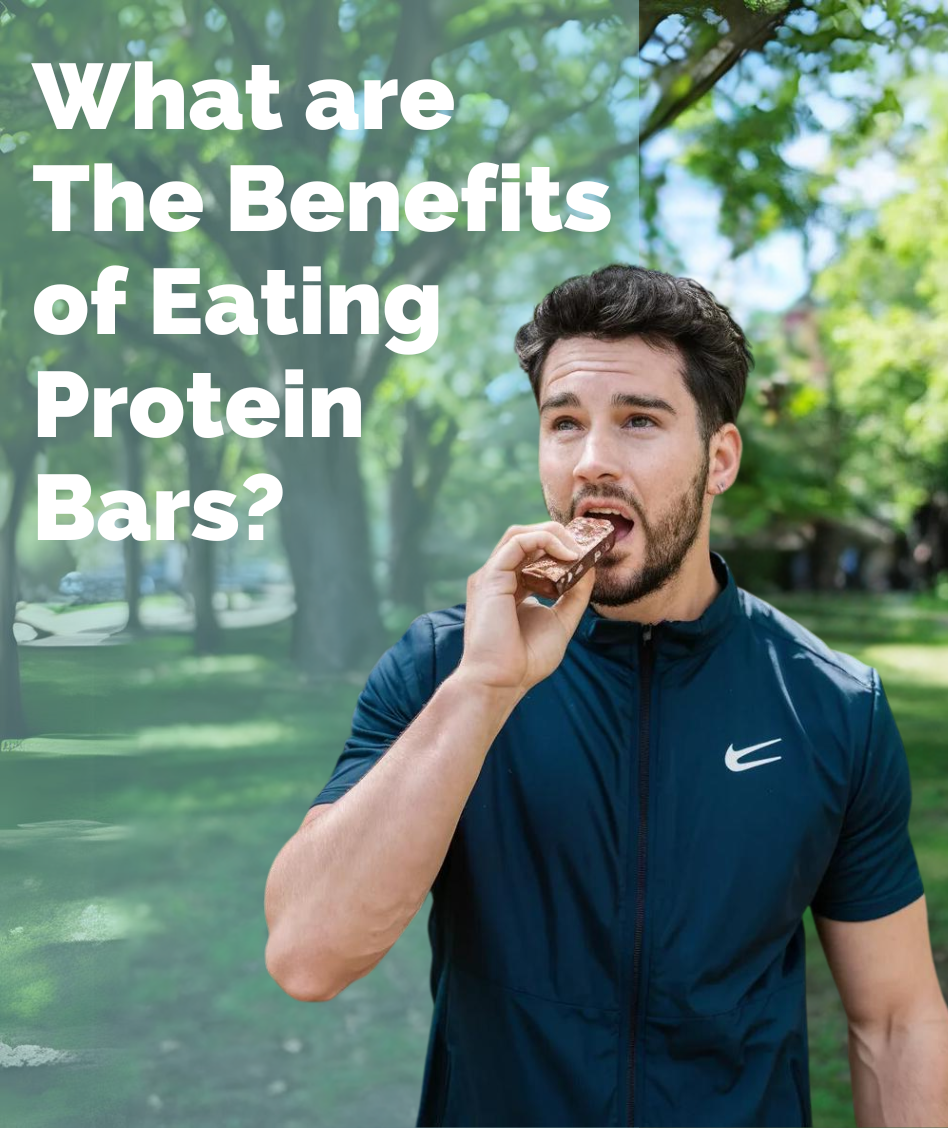 Guy standing and eating protein bar